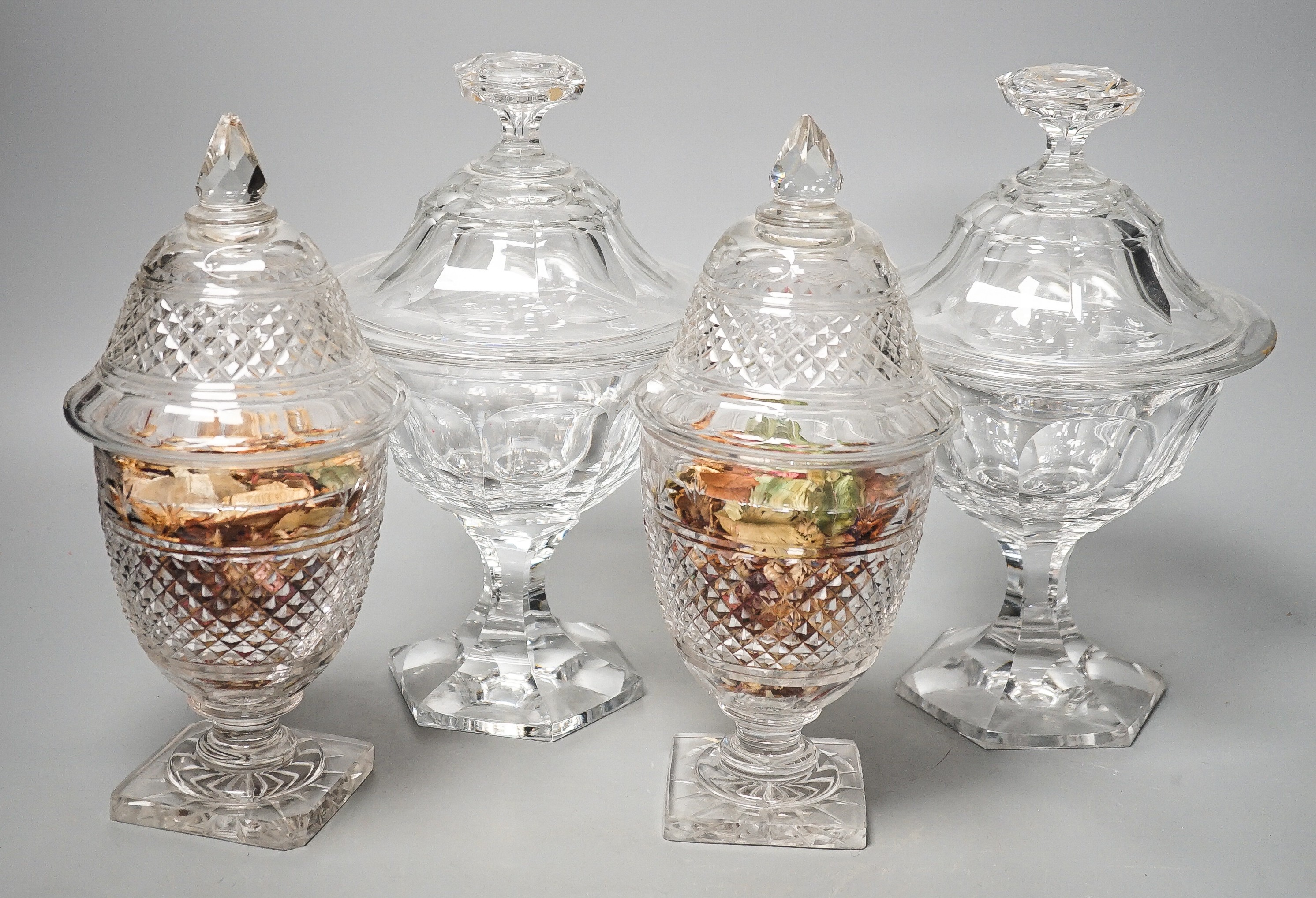 Two pairs of 19th century cut glass glass sweetmeat jars and covers (one a.f.), tallest 25 cms high.